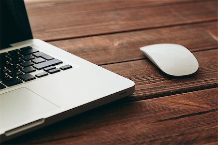 simsearch:400-08252729,k - Close-up shot of laptop and mouse on old wooden desk Stock Photo - Budget Royalty-Free & Subscription, Code: 400-08251764