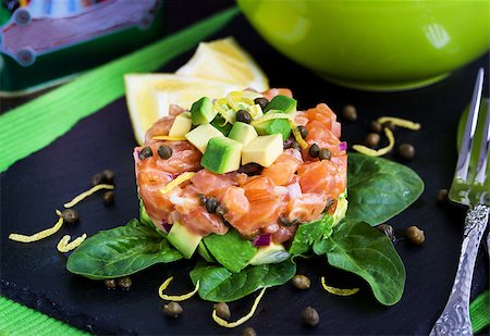 pickled lemon - Tasty salmon and avocado tartar, dark background Stock Photo - Budget Royalty-Free & Subscription, Code: 400-08251968