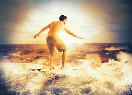 riding on the beach in the sun set - Guy surfs the waves of the ocean Stock Photo - Budget Royalty-Free & Subscription, Code: 400-08252149