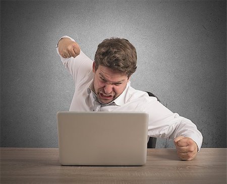 simsearch:400-09030070,k - Stressed businessman breaks the computer with punch Stock Photo - Budget Royalty-Free & Subscription, Code: 400-08252141
