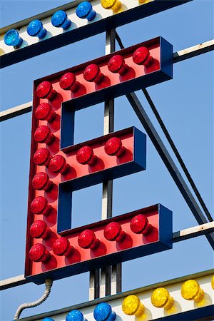 classic electric sign like the ones used in circus or old fashioned shops representing the E letter Foto de stock - Super Valor sin royalties y Suscripción, Código: 400-08252377