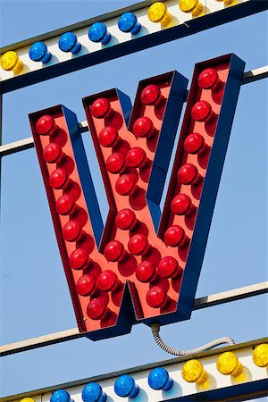 classic electric sign like the ones used in circus or old fashioned shops representing the W letter Foto de stock - Super Valor sin royalties y Suscripción, Código: 400-08252379
