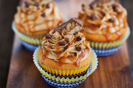 Fresh delicious cream and caramel cupcakes Stock Photo - Budget Royalty-Free & Subscription, Code: 400-08252437