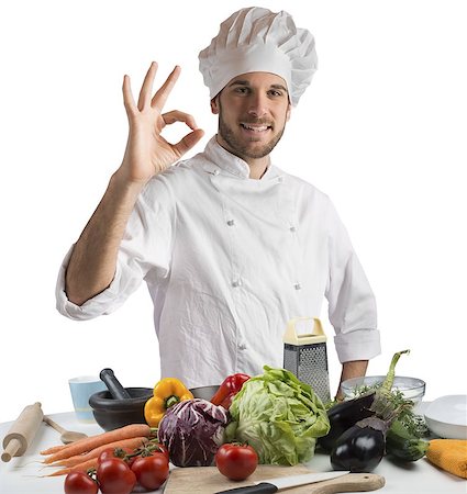 simsearch:400-08254392,k - Confident and expert chef promotes his cuisine Foto de stock - Super Valor sin royalties y Suscripción, Código: 400-08252463