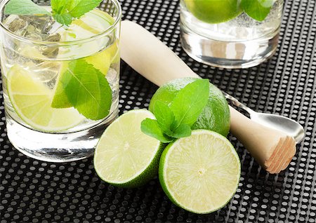 Mojito cocktail and ingredients over black rubber mat Stock Photo - Budget Royalty-Free & Subscription, Code: 400-08252557