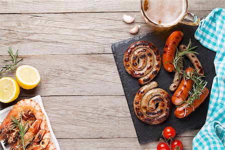 penaeus monodon - Beer mug, grilled shrimps and sausages on wooden table. Top view with copy space Stock Photo - Budget Royalty-Free & Subscription, Code: 400-08252566