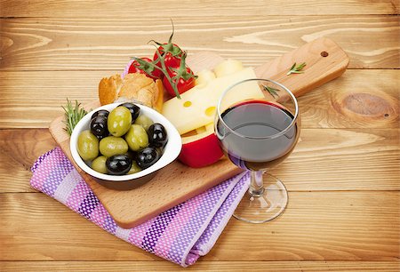 simsearch:400-07481818,k - Red wine with cheese, olives, bread, vegetables and spices on wooden table Foto de stock - Super Valor sin royalties y Suscripción, Código: 400-08252585