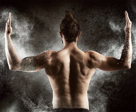 Muscle man shows off his muscular back Stock Photo - Budget Royalty-Free & Subscription, Code: 400-08252674