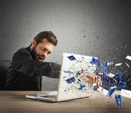 simsearch:400-09030070,k - Angry businessman breaks the pc in office Stock Photo - Budget Royalty-Free & Subscription, Code: 400-08252758