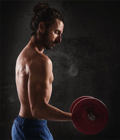 simsearch:400-08505882,k - Sexy shirtless man training biceps with weights Stock Photo - Budget Royalty-Free & Subscription, Code: 400-08252751