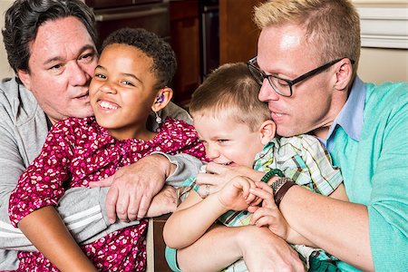 Gay parents kissing and hugging their children Stock Photo - Budget Royalty-Free & Subscription, Code: 400-08252862