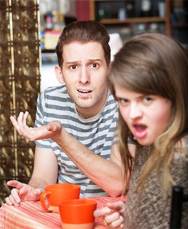 disgusting coffee - Disgusted young woman with frustrated man at cafe Stock Photo - Budget Royalty-Free & Subscription, Code: 400-08252896