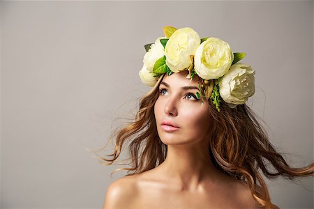 elegant bride hairstyle - Portrait of a Young Woman in Flower Wreath with Waving Hair on Gray Background. Natural Beauty Concept. Copy Space. Stock Photo - Budget Royalty-Free & Subscription, Code: 400-08252945