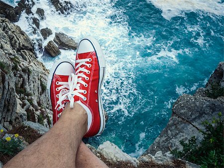 Men's feet on the cliff Stock Photo - Budget Royalty-Free & Subscription, Code: 400-08252994