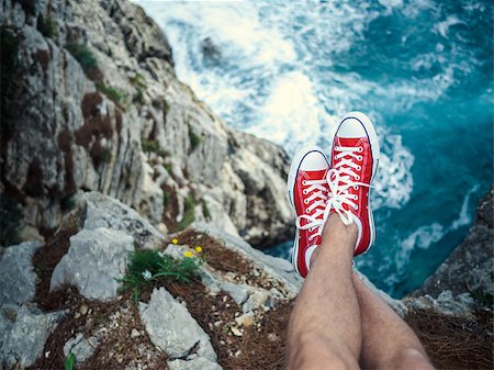 Men's feet on the cliff Stock Photo - Budget Royalty-Free & Subscription, Code: 400-08252995