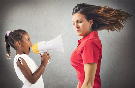 protesta - Child screaming with megaphone to an adult Stock Photo - Budget Royalty-Free & Subscription, Code: 400-08253026