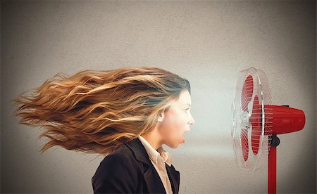 sweaty bussiness females - The air fan moves the woman hair Stock Photo - Budget Royalty-Free & Subscription, Code: 400-08253051