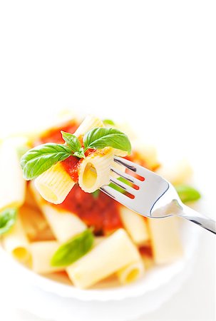 simsearch:400-04031652,k - Pasta with Tomato Sauce and Basil on a Fork. Italian food. Mediterranean cuisine Stock Photo - Budget Royalty-Free & Subscription, Code: 400-08253137