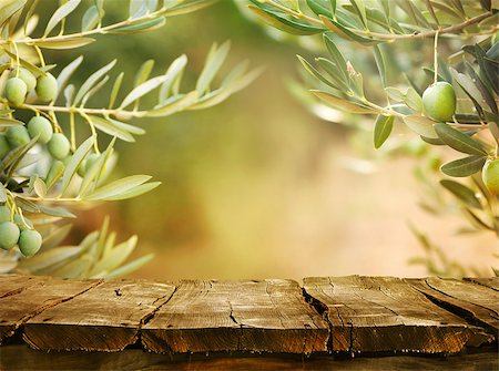 Olives with table. Wooden table with olive trees Stockbilder - Microstock & Abonnement, Bildnummer: 400-08253157