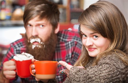 Grinning woman pointing to clueless man with cream on his beard Stock Photo - Budget Royalty-Free & Subscription, Code: 400-08253182