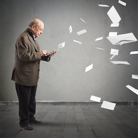 Old man send email from his tablet Stock Photo - Budget Royalty-Free & Subscription, Code: 400-08253208