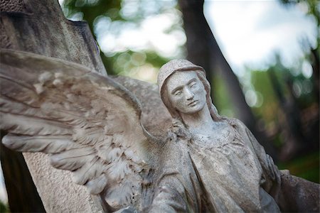 simsearch:400-08254774,k - Old concrete statue of angel at Rasu cemetery in Vilnius Lithuania. Shot taken with a soft focus lens, shallow depth of field. Stock Photo - Budget Royalty-Free & Subscription, Code: 400-08253482