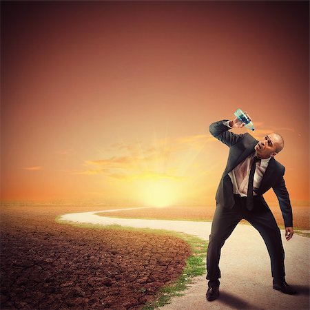 picture of thirsty man in desert - Desperate thirsty businessman in a dry path Stock Photo - Budget Royalty-Free & Subscription, Code: 400-08253757