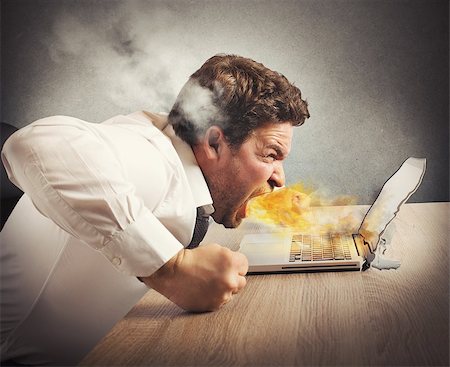 simsearch:400-08258105,k - Businessman spits fire and melts the computer Stock Photo - Budget Royalty-Free & Subscription, Code: 400-08253837
