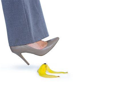 Woman with heel shoes walking on banana on white background Stock Photo - Budget Royalty-Free & Subscription, Code: 400-08264446
