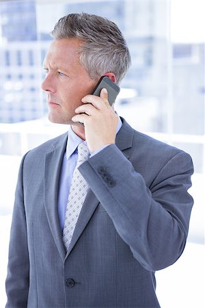 simsearch:400-07139155,k - Anxious businessman on the phone in the office Stock Photo - Budget Royalty-Free & Subscription, Code: 400-08264485