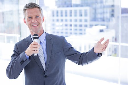 simsearch:400-06879262,k - Businessman making a speech in the office Stock Photo - Budget Royalty-Free & Subscription, Code: 400-08264489