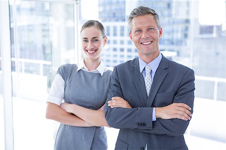simsearch:400-06879262,k - Business colleagues smiling at the camera in the office Stock Photo - Budget Royalty-Free & Subscription, Code: 400-08264497