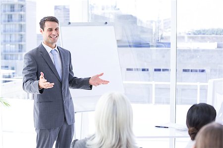 slide business man - Business team looking at white screen in the meeting room Stock Photo - Budget Royalty-Free & Subscription, Code: 400-08264541