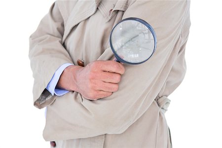 Spy looking through magnifier on white background Fotografie stock - Microstock e Abbonamento, Codice: 400-08264636