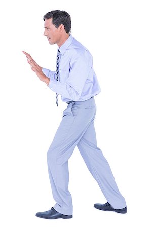 simsearch:400-06879262,k - Businessman walking while gesturing with hands on a white background Stock Photo - Budget Royalty-Free & Subscription, Code: 400-08264648