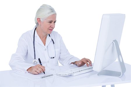 simsearch:6109-06006905,k - Doctor working on her computer on a white screen Stock Photo - Budget Royalty-Free & Subscription, Code: 400-08264720