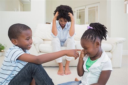 simsearch:877-07460598,k - Frustrated mother watching children fight at home in the living room Stock Photo - Budget Royalty-Free & Subscription, Code: 400-08265554