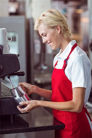 simsearch:400-08265905,k - Pretty barista using the coffee machine at the cafe Foto de stock - Super Valor sin royalties y Suscripción, Código: 400-08265822