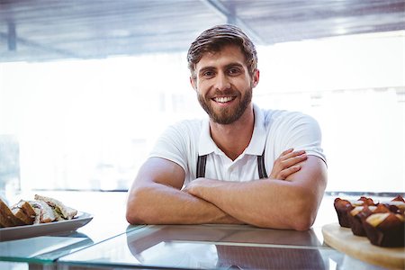 simsearch:400-08265905,k - Handsome worker posing on the counter at the bakery Foto de stock - Super Valor sin royalties y Suscripción, Código: 400-08265879