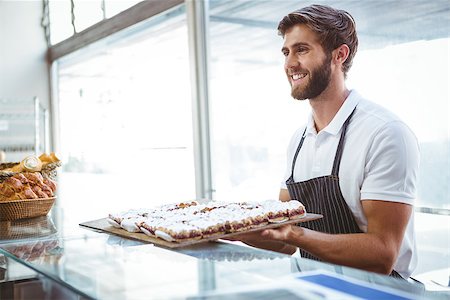 simsearch:400-08265905,k - happy server holding pastry at the backery Foto de stock - Super Valor sin royalties y Suscripción, Código: 400-08265888