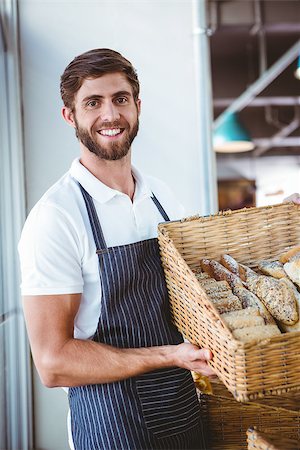 simsearch:400-08265905,k - Portrait of happy worker holding basket of bread at the bakery Foto de stock - Super Valor sin royalties y Suscripción, Código: 400-08265908