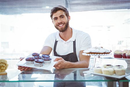 Smiling worker posing behind the counter at the bakery Stock Photo - Budget Royalty-Free & Subscription, Code: 400-08265918