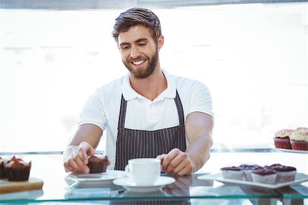 simsearch:400-08265905,k - Smiling worker prepares breakfast at the bakery Foto de stock - Super Valor sin royalties y Suscripción, Código: 400-08265920