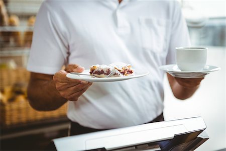 simsearch:400-08265905,k - Smiling worker prepares breakfast at the bakery Foto de stock - Super Valor sin royalties y Suscripción, Código: 400-08265952