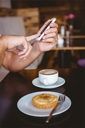 Close up view of hands texting at the cafe Stock Photo - Budget Royalty-Free & Subscription, Code: 400-08265968