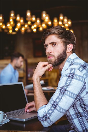 young man working on his computer at the cafe Stock Photo - Royalty-Free, Artist: 4774344sean, Image code: 400-08266012