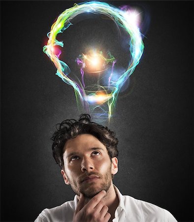 simsearch:640-01354128,k - Businessman with thoughtful expression with light bulb Photographie de stock - Aubaine LD & Abonnement, Code: 400-08260347