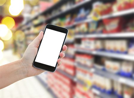 simsearch:400-04393261,k - someones  hand holding mobile smart phone with empty screen  on supermarket blur background business concept Foto de stock - Super Valor sin royalties y Suscripción, Código: 400-08260785