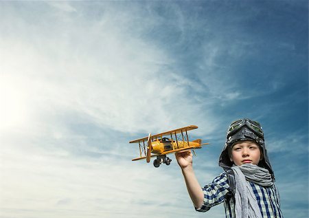 pilots with scarves - Little boy with wooden airplane outdoors Stock Photo - Budget Royalty-Free & Subscription, Code: 400-08261135