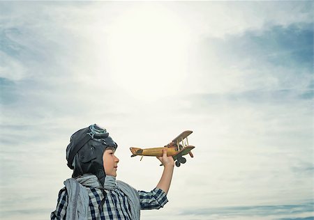 pilots with scarves - Little boy with wooden airplane outdoors Stock Photo - Budget Royalty-Free & Subscription, Code: 400-08261133